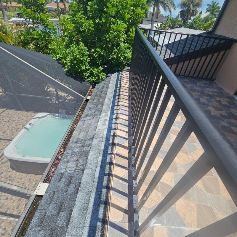 Shingle roof to flat deck transition inspection Cape Coral