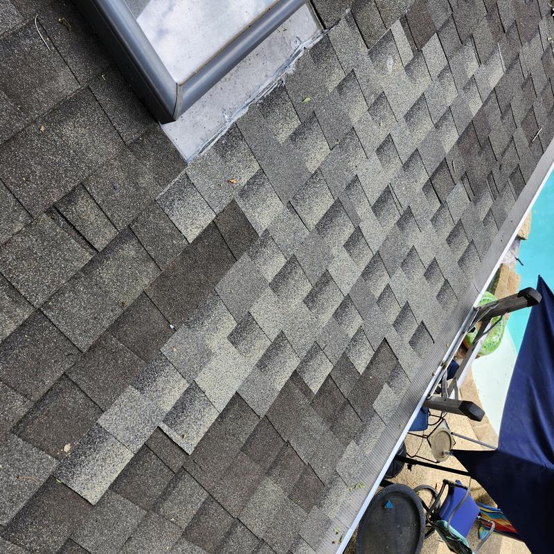 GAF Weatherwood roof shingles near skylight and pool GAF Weatherwood roof shingles near skylight and pool