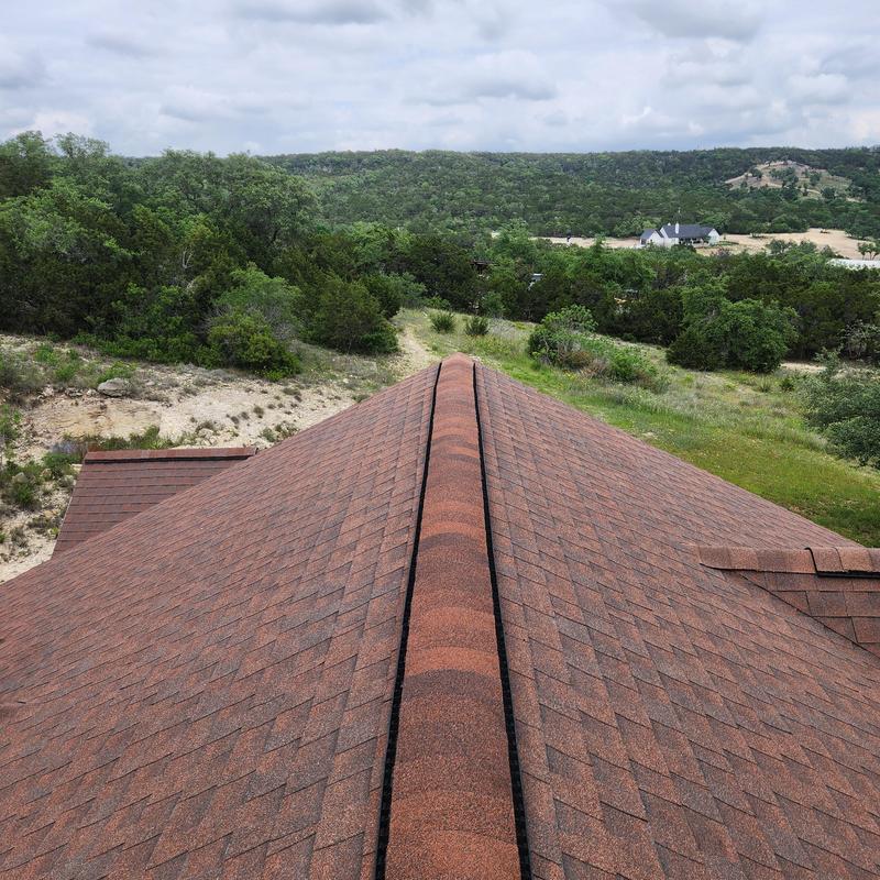 Ridge vent and shingle roofing with new installation