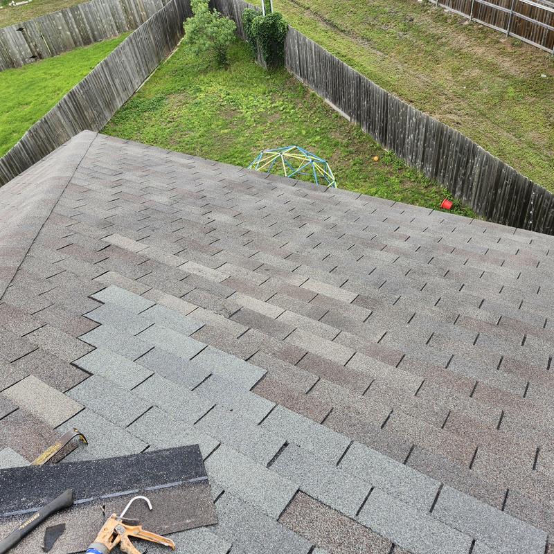 Weather gray asphalt shingles installation on roof