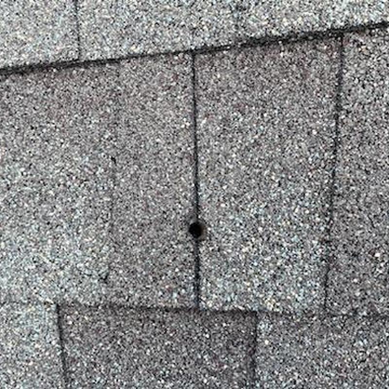 GAF Weatherwood shingles with bullet hole damage
