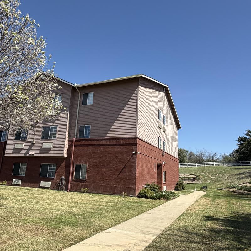 Hanging gutter piece on third-floor commercial building