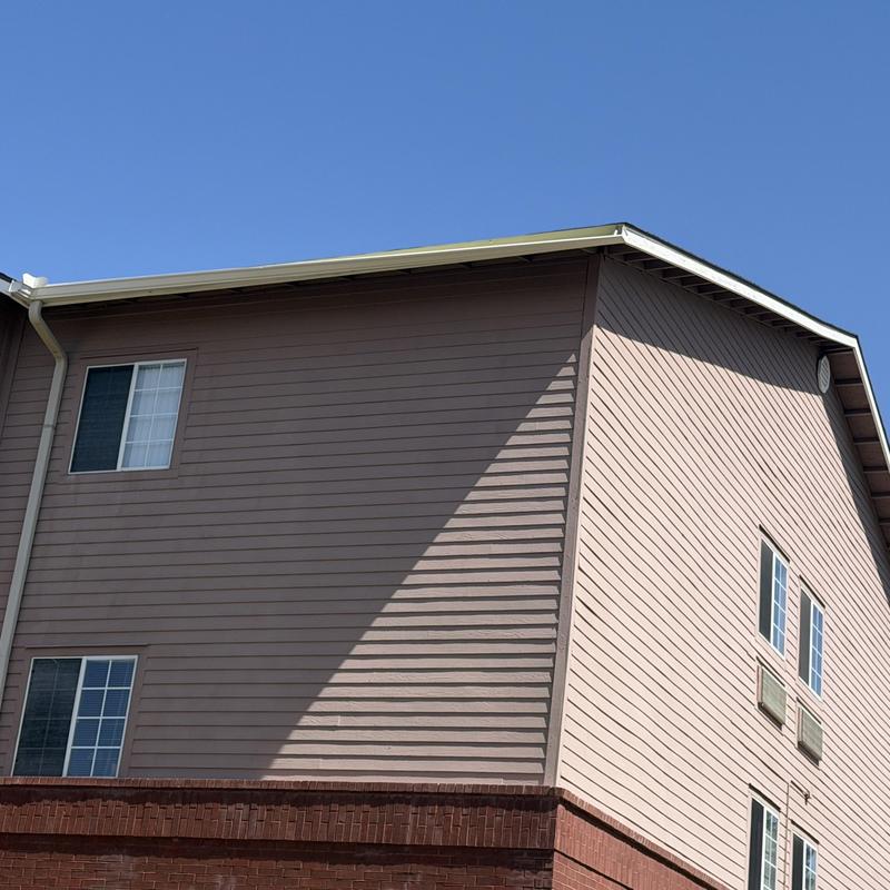 Gutter hanging from third floor exterior wall