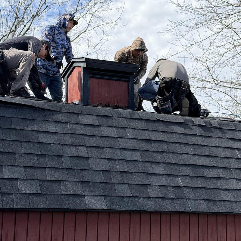 Three dimensional architectural shingles on barn roof installation