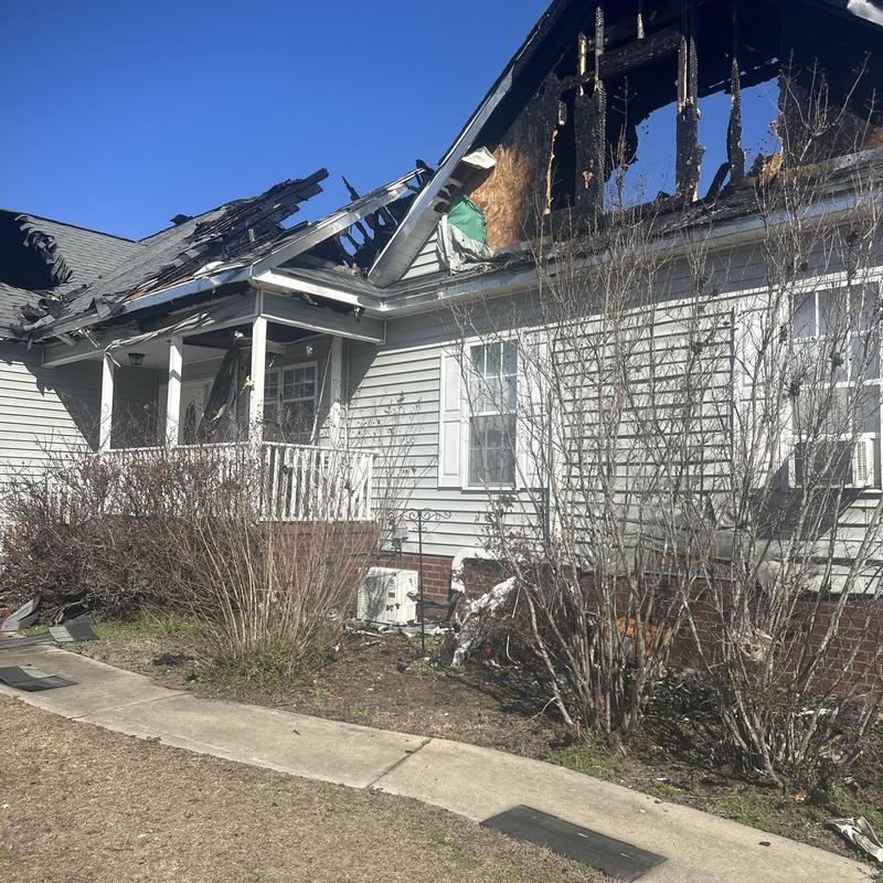 Roof and siding fire damage on residential house Roof and siding fire damage on residential house