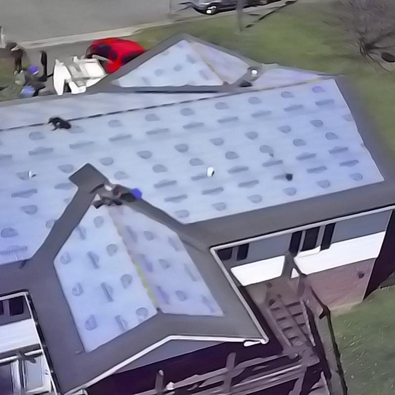 Roof underlayment installation on residential house