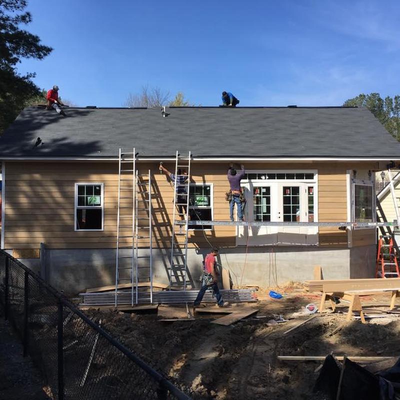 Asphalt shingle roof installation on mail center structure