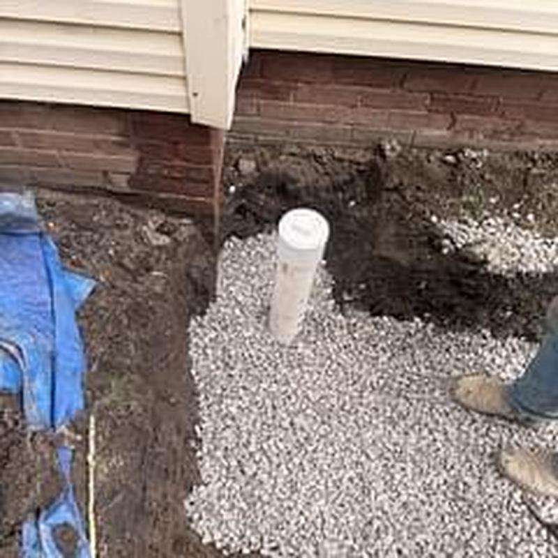 Sewer line cleanout installation with gravel backfill