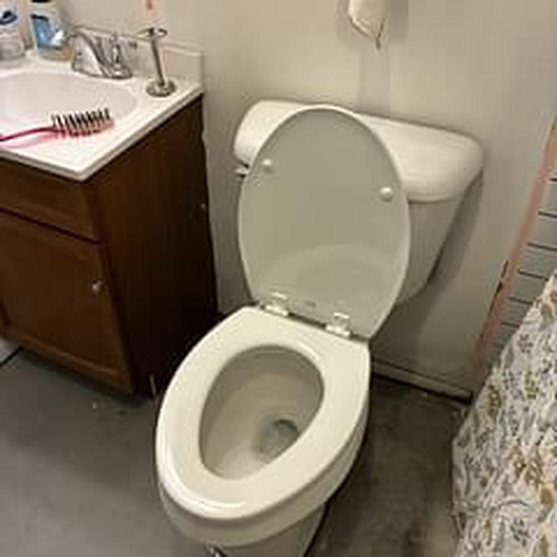 Mansfield elongated bowl toilet with open lid installed