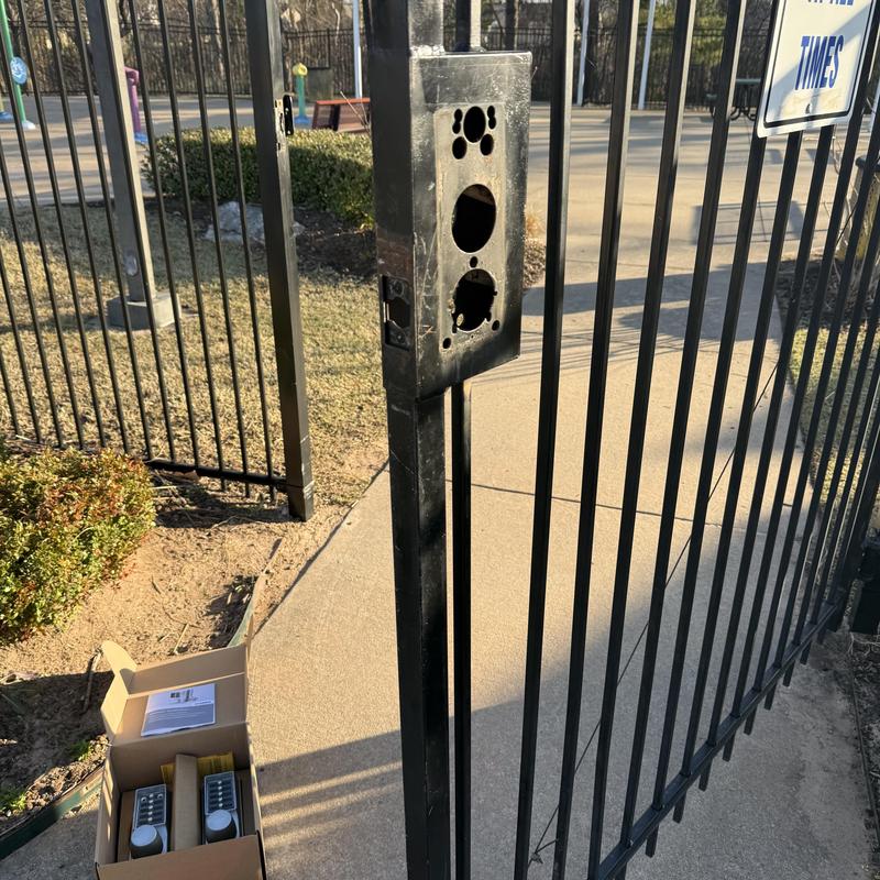 Simplex keypad lock housing on gated splash pad entrance