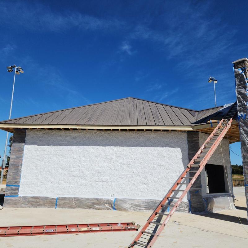 Standing seam metal roof on concession stand at park
