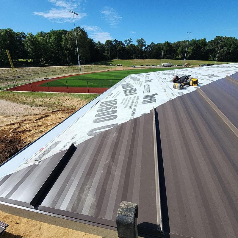 Standing seam metal roof installation at Big Oak Park
