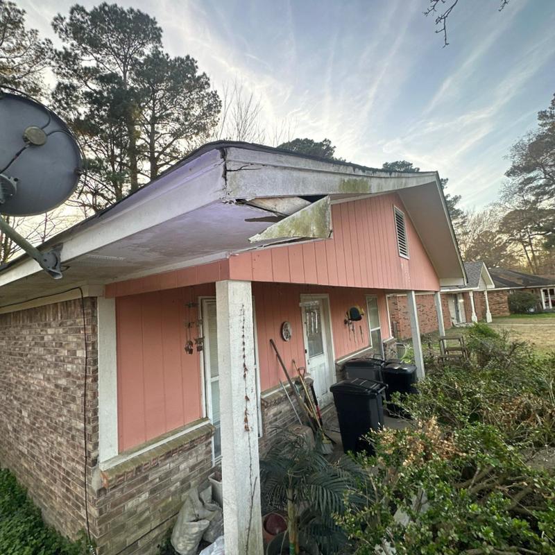 Eavestrough and fascia board damage on residential roof