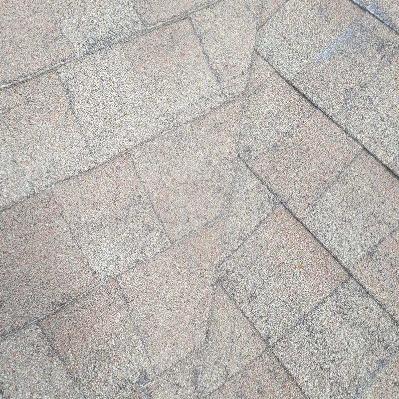 Asphalt roof shingles with hail storm damage in Terrell, TX