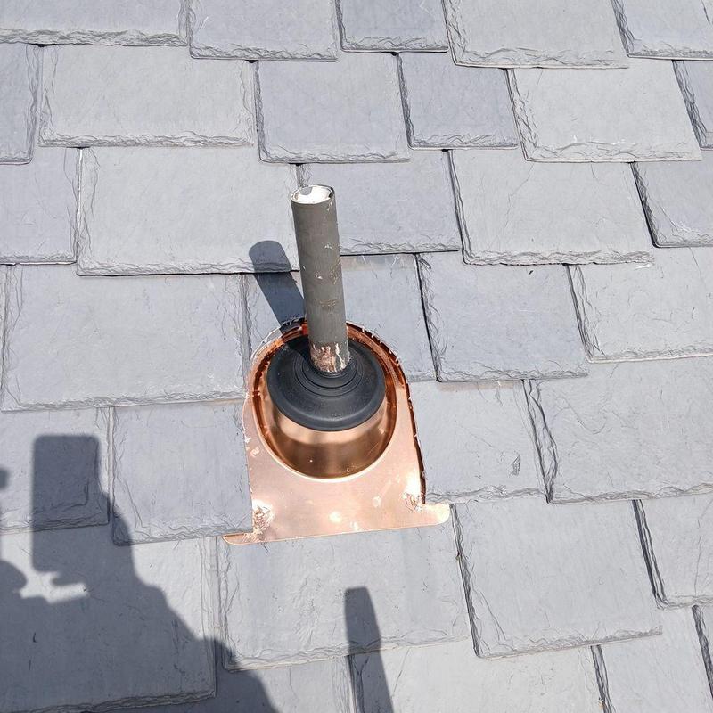 Synthetic roofing tiles with pipe flashing installation