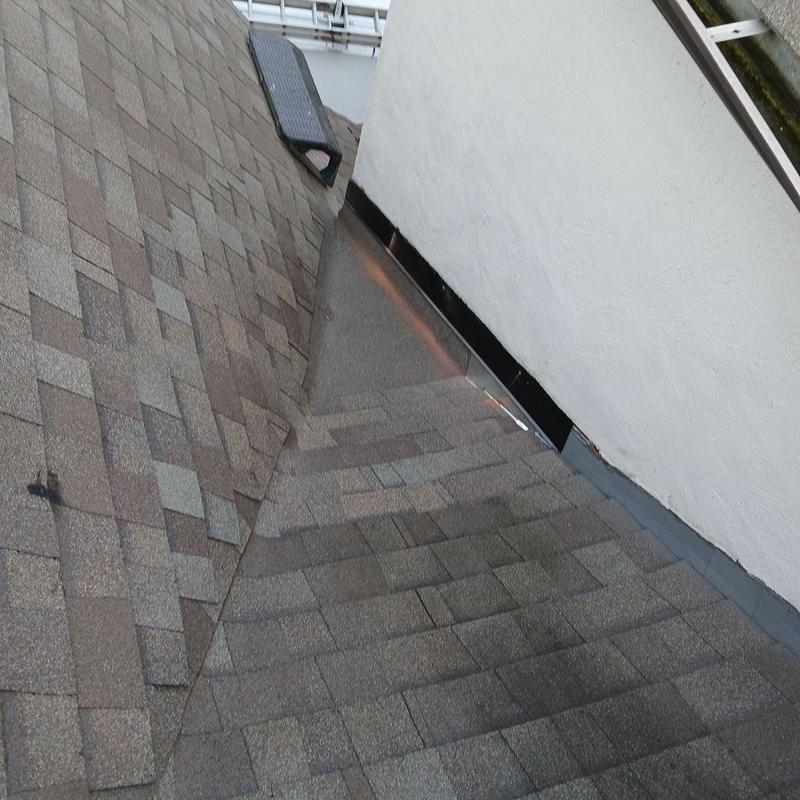 Dead valley roof flashing with metal pan and shingles