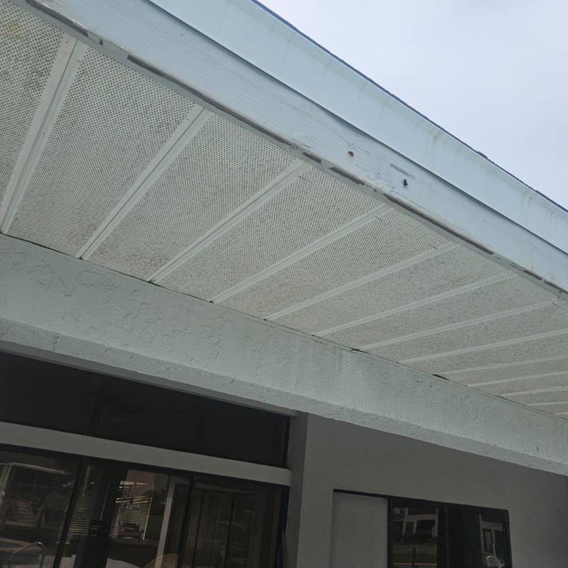 Soffit panels with damaged fascia on home exterior