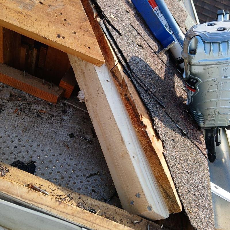 Roof framing repair with new wood and shingles