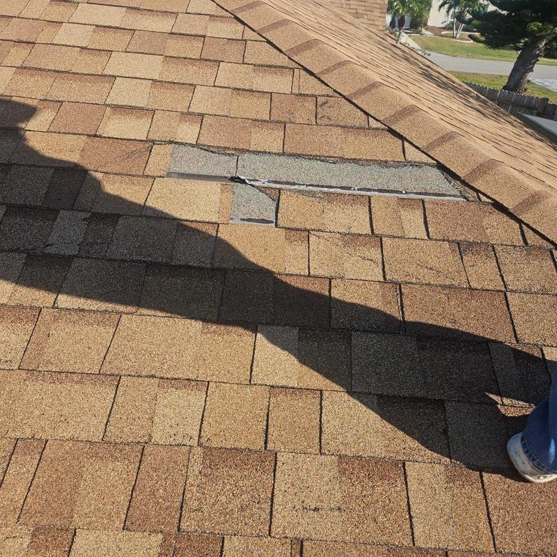 Shingle roof with missing and damaged shingles