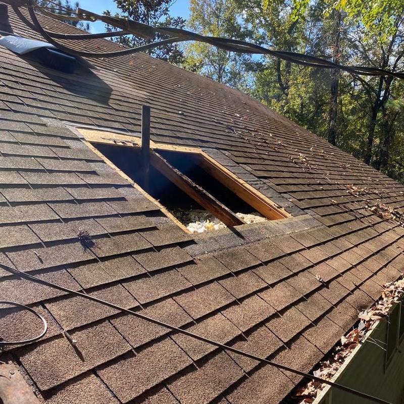 Roof shingle removal and roof vent installation site Roof shingle removal and roof vent installation site