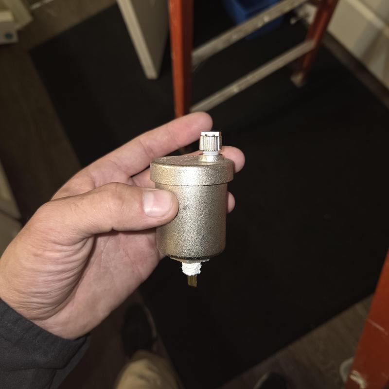 Separator valve for HVAC system replacement in hand
