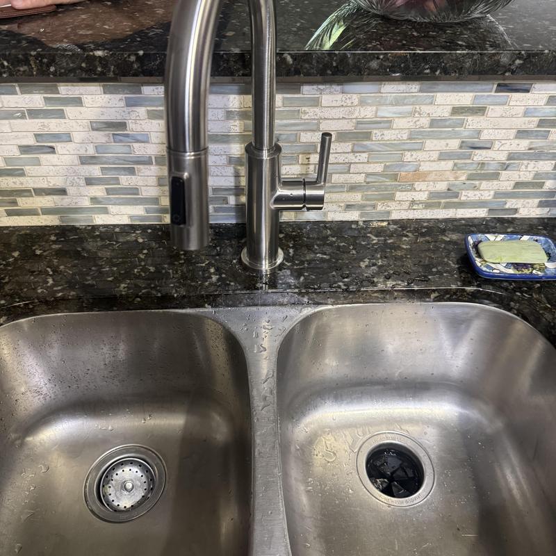 Kitchen sink faucet with soap dish and backsplash tiles