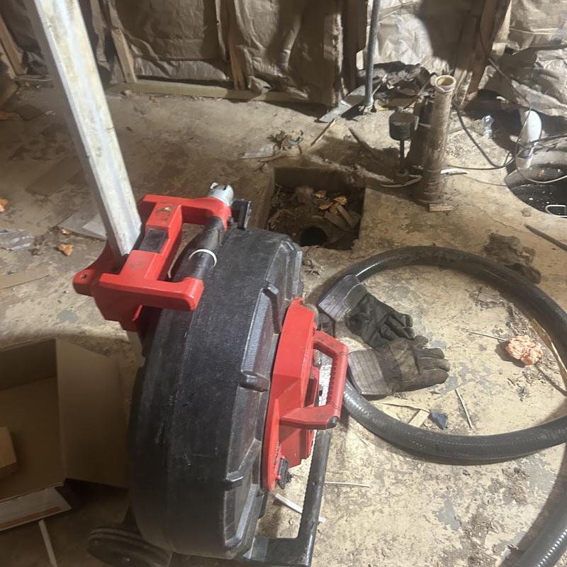 Drain pipe inspection camera setup in basement floor Drain pipe inspection camera setup in basement floor