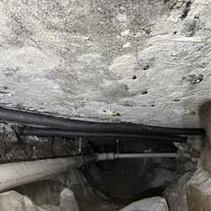 Sub-slab PVC drainage pipes installed with hangers