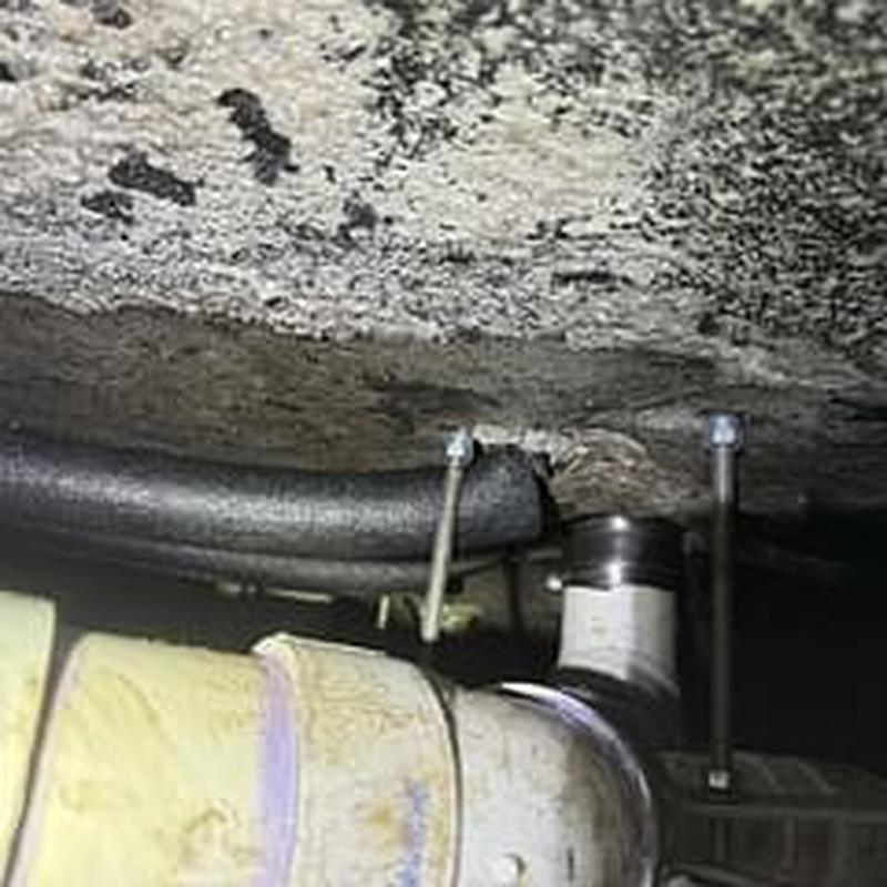 Sub-slab PVC drainage system with hangers installed