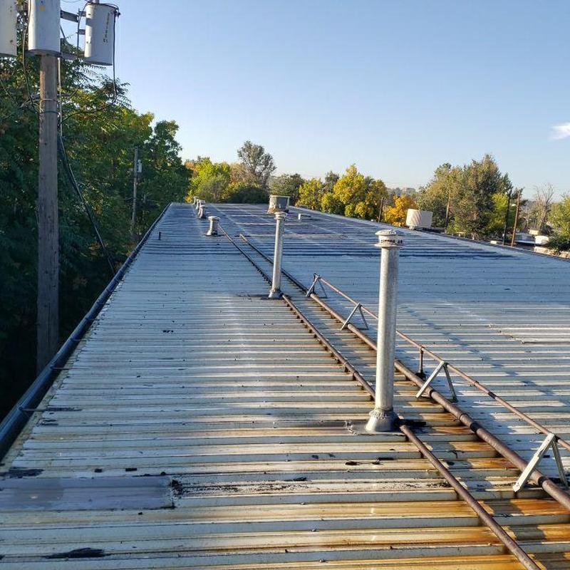 Metal roof with multiple pipe jacks and flashing screws Metal roof with multiple pipe jacks and flashing screws