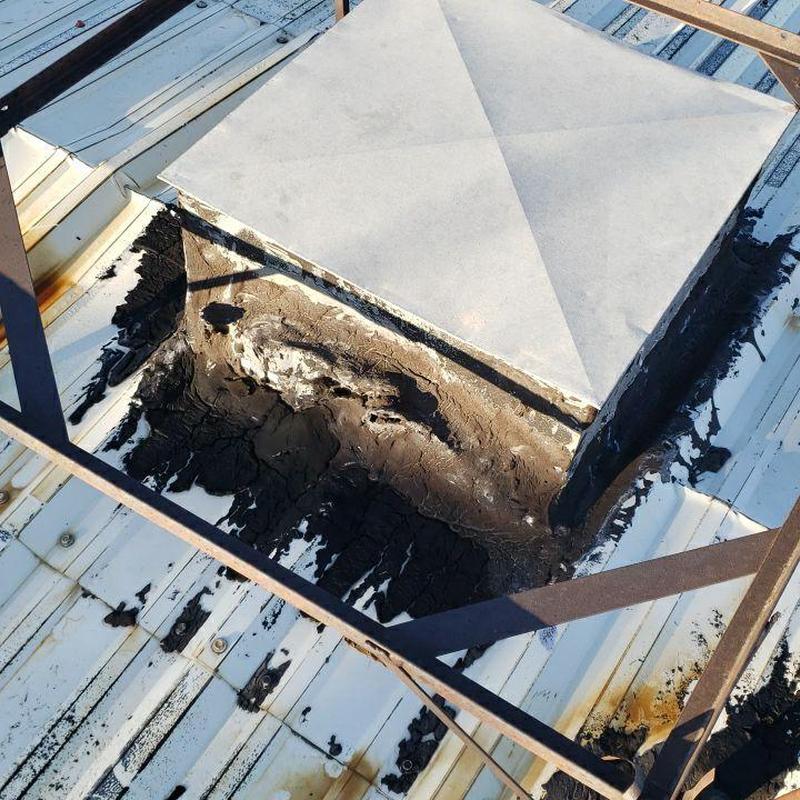 Metal roof pipe jack with deteriorated sealant and flashing Metal roof pipe jack with deteriorated sealant and flashing