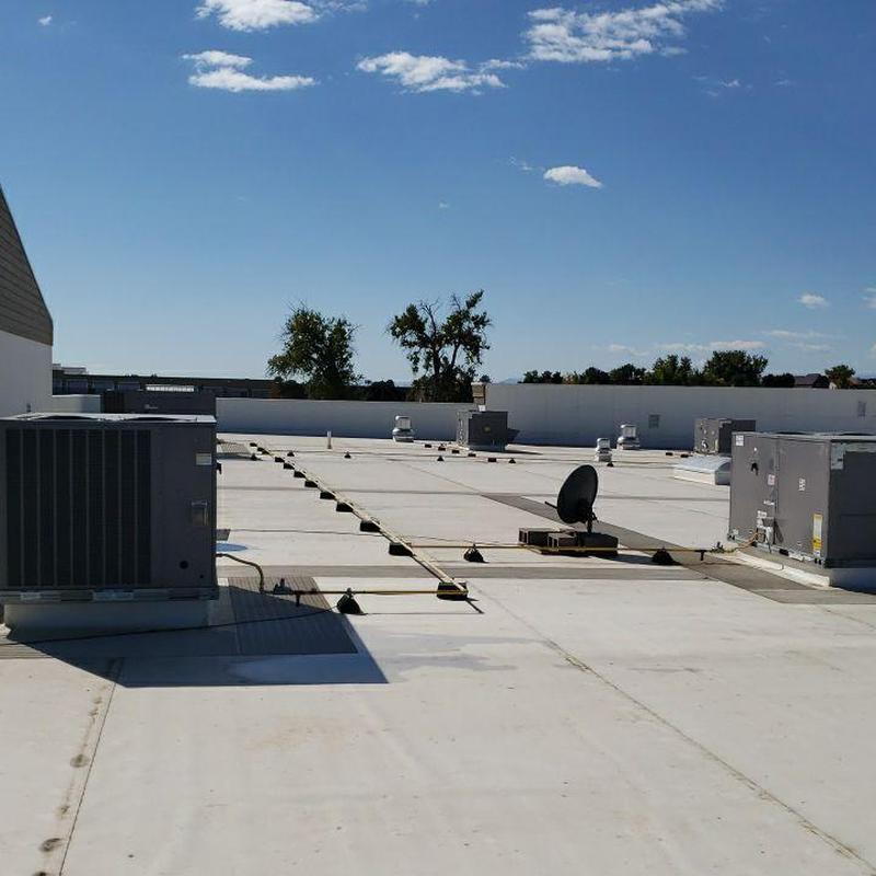 TPO flat roof with HVAC units and satellite dish TPO flat roof with HVAC units and satellite dish