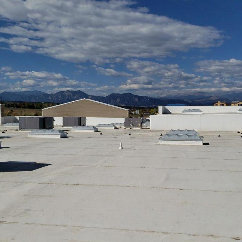 TPO flat roof with HVAC units and mountain view TPO flat roof with HVAC units and mountain view
