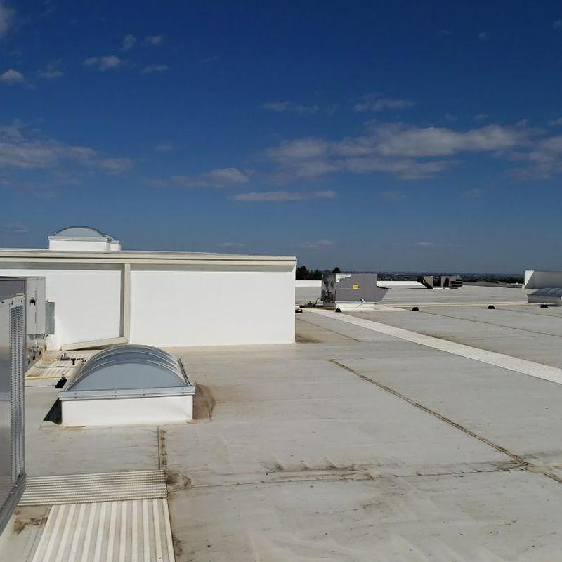 TPO flat roof at fitness facility with HVAC units TPO flat roof at fitness facility with HVAC units
