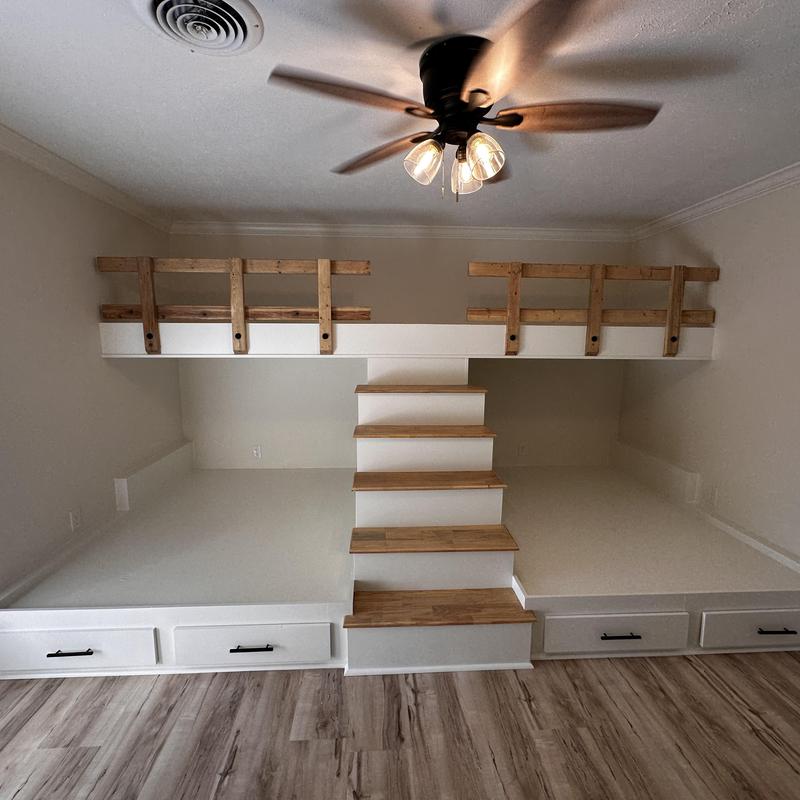Custom wooden bunk beds with stairs and storage drawers