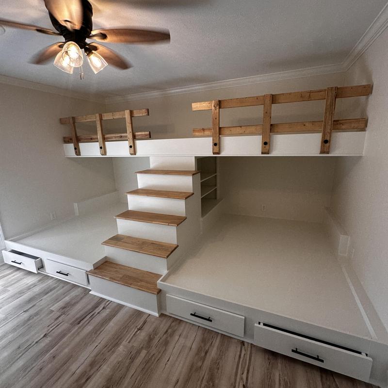 Custom wooden bunk beds with staircase and storage drawers
