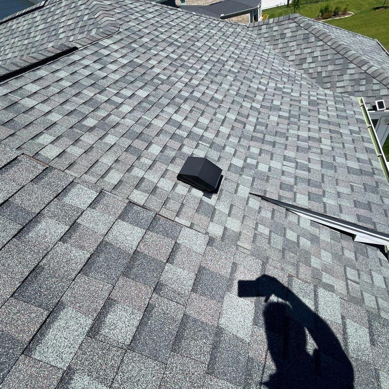 Roof shingles with hail damage inspection and ridge vent