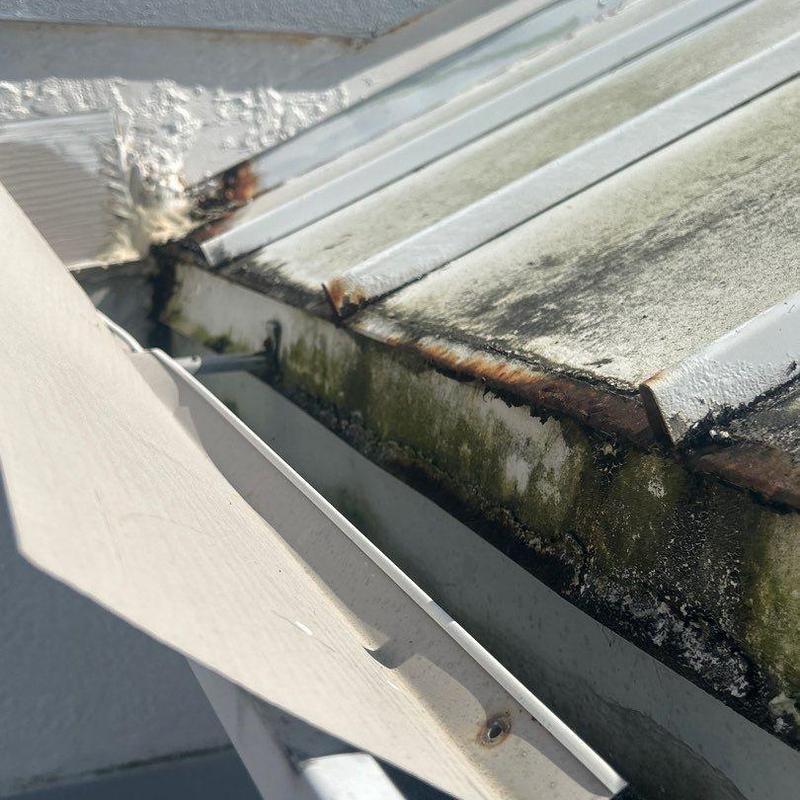 Standing seam metal roof with rust and corrosion
