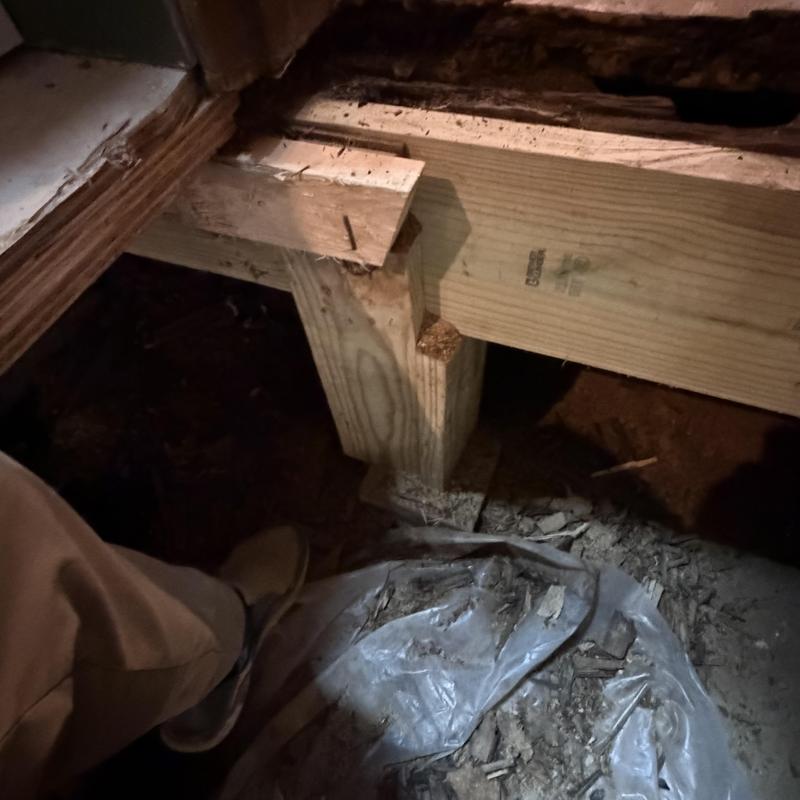 Wooden floor joist support installation under bathroom floor