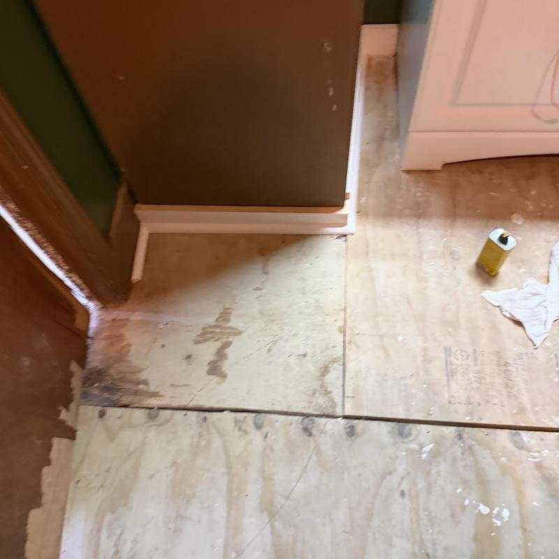 Plywood subfloor repair in bathroom corner area