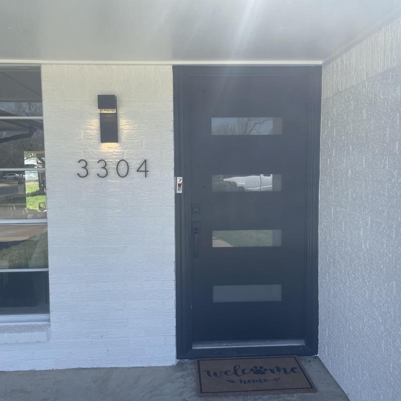Front entry door with frosted glass panels and black finish Front entry door with frosted glass panels and black finish
