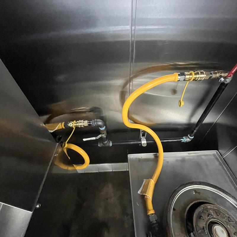 Commercial kitchen gas line with yellow flexible hose Commercial kitchen gas line with yellow flexible hose