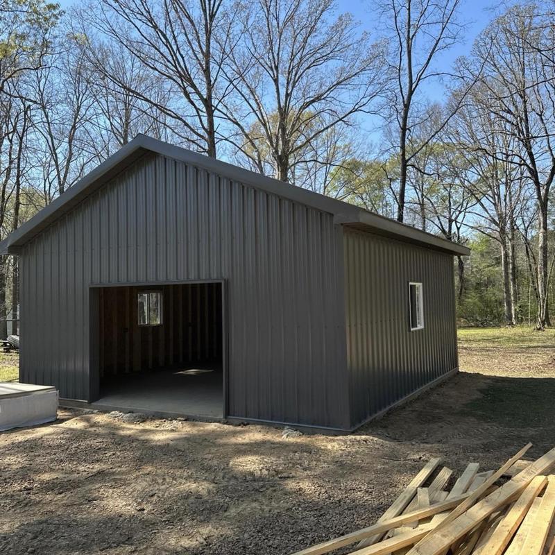 Metal siding installation on new construction building