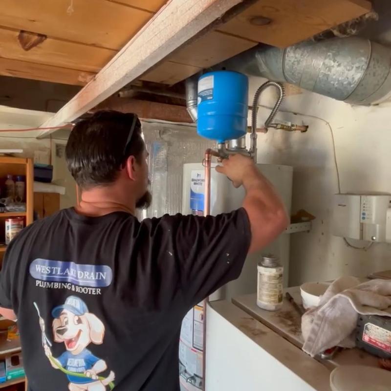 Water heater installation with expansion tank in basement