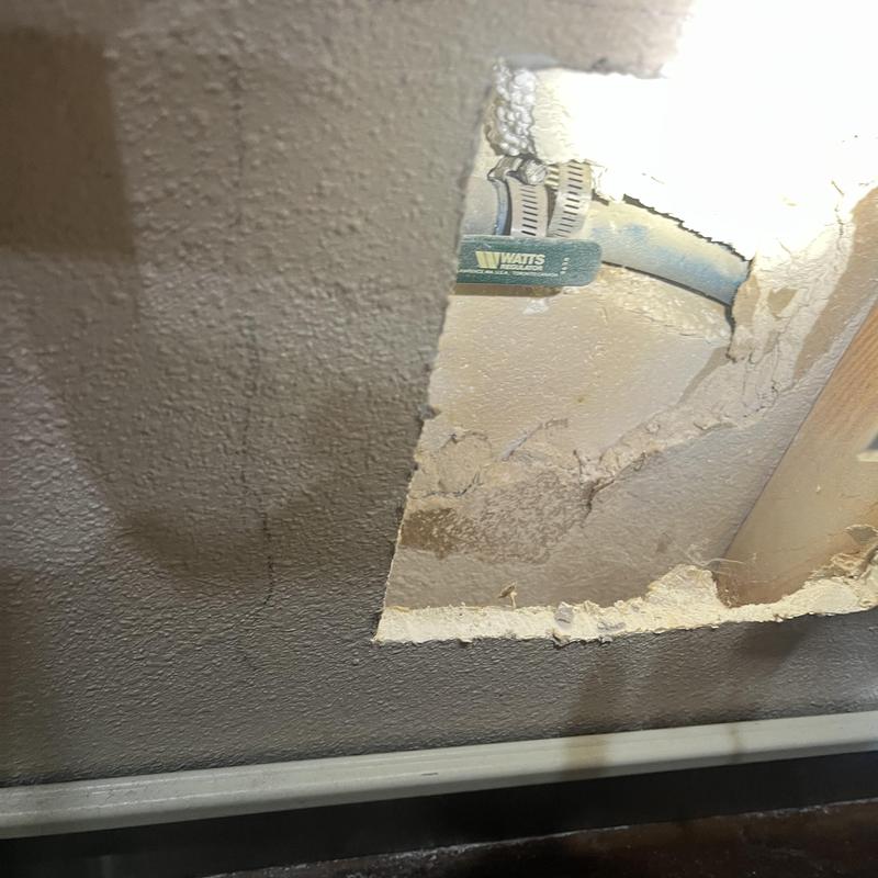 Blue poly water line inside wall cavity inspection