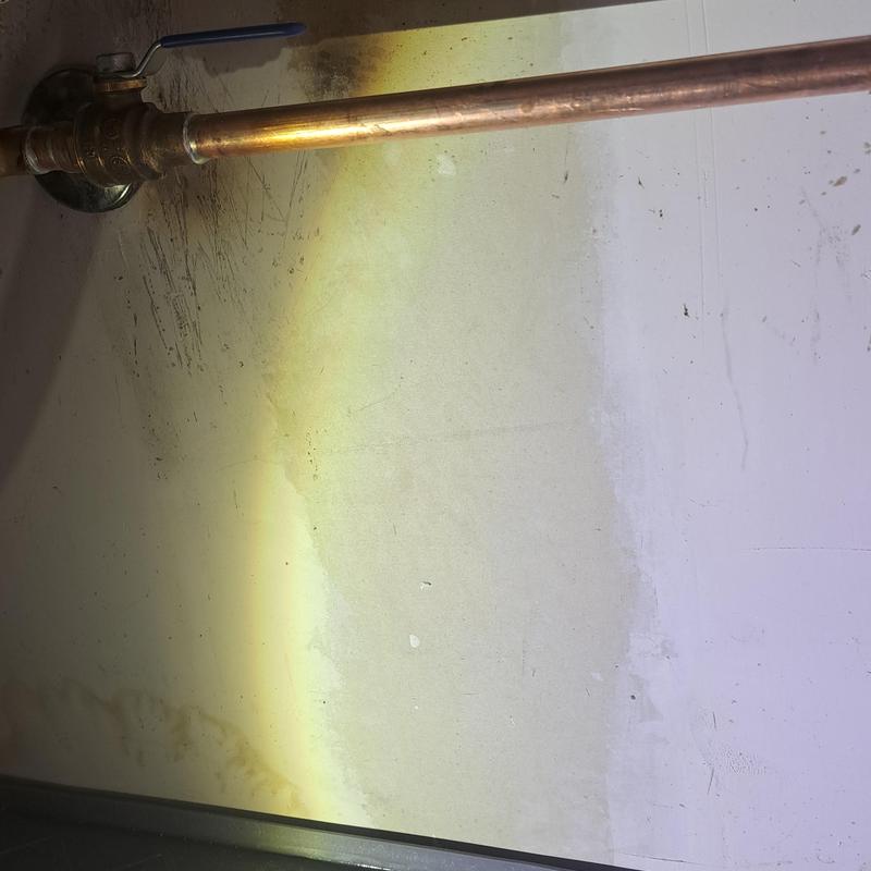 Copper cold water line and valve under kitchen sink