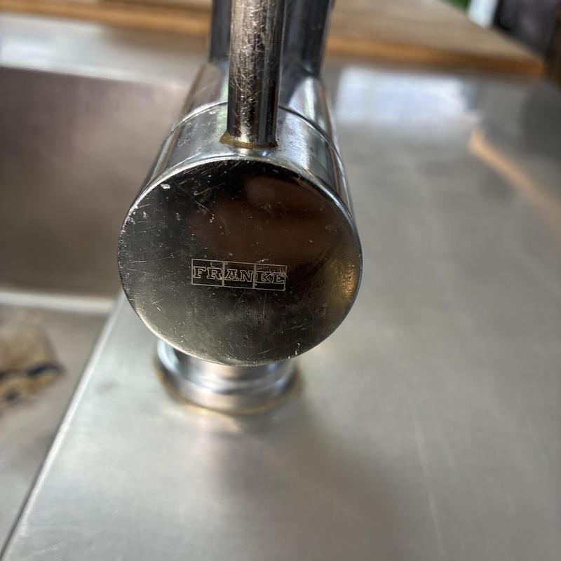 Franke kitchen faucet close-up on stainless sink
