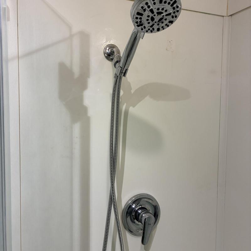 Shower head and hose replacement in white shower stall