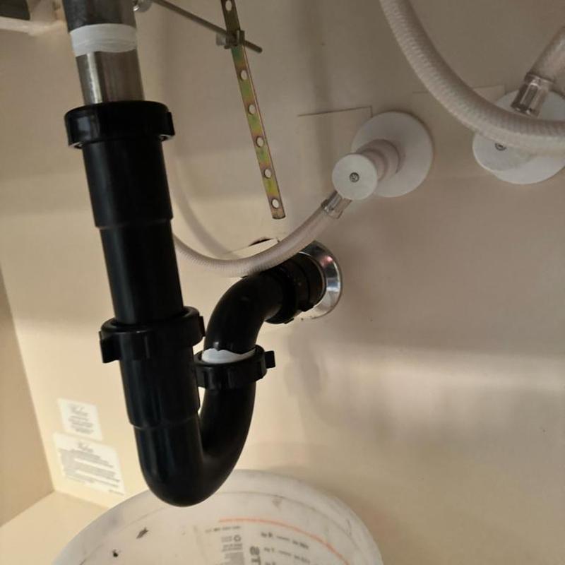 Pop-up drain assembly and p-trap cleaning in cabinet Pop-up drain assembly and p-trap cleaning in cabinet