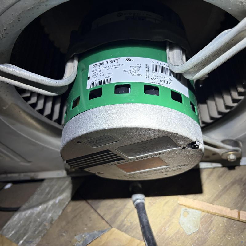 Blower motor installation in HVAC system close-up
